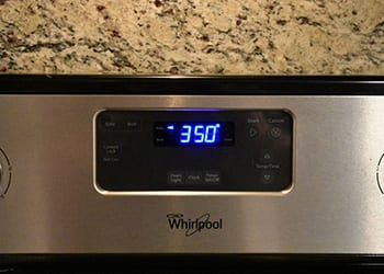 Whirlpool oven control panel displaying 350 degrees in blue